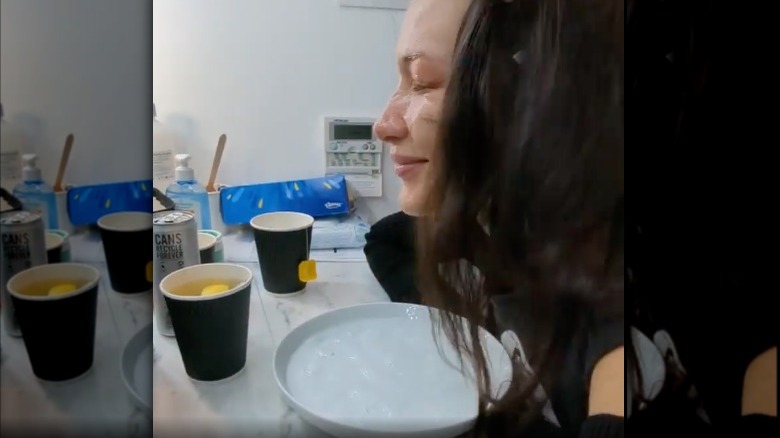 Bella Hadid doing face ice bath 