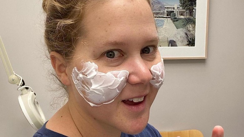 Amy Schumer with cream on cheeks 