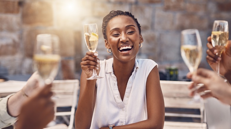 Girl cheering with champagne