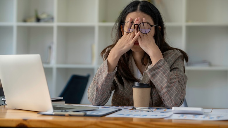 woman stresses at work