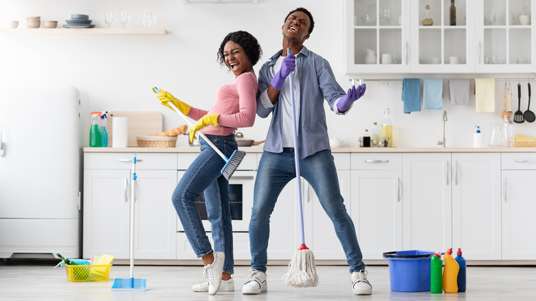 cleaning couple singing