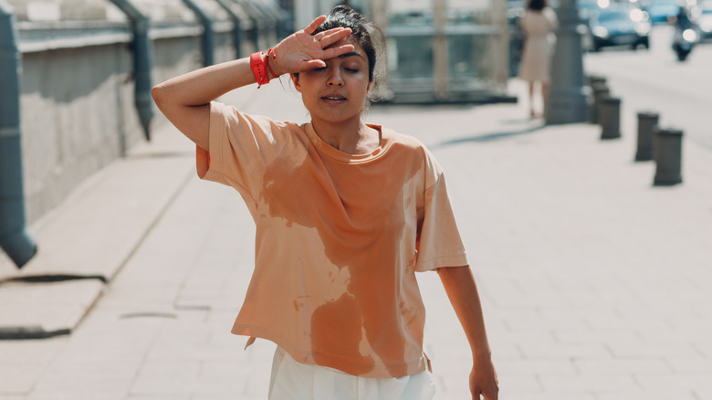 Woman sweating outside while walking