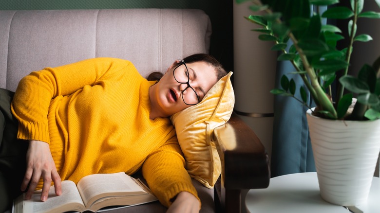 Woman sleeping on couch