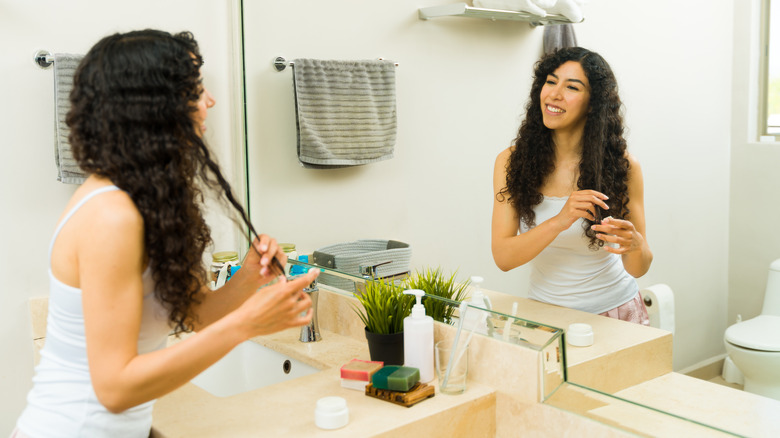 woman raking hair with fingers