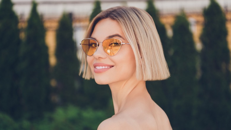 short haired girl in sunglasses