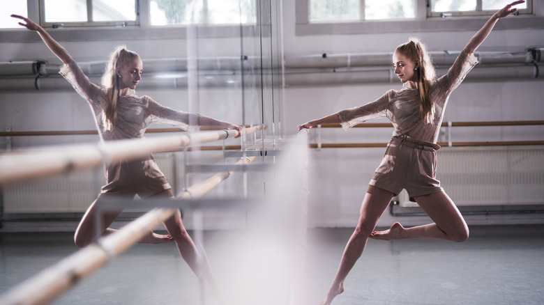 Woman smiling while practicing ballet