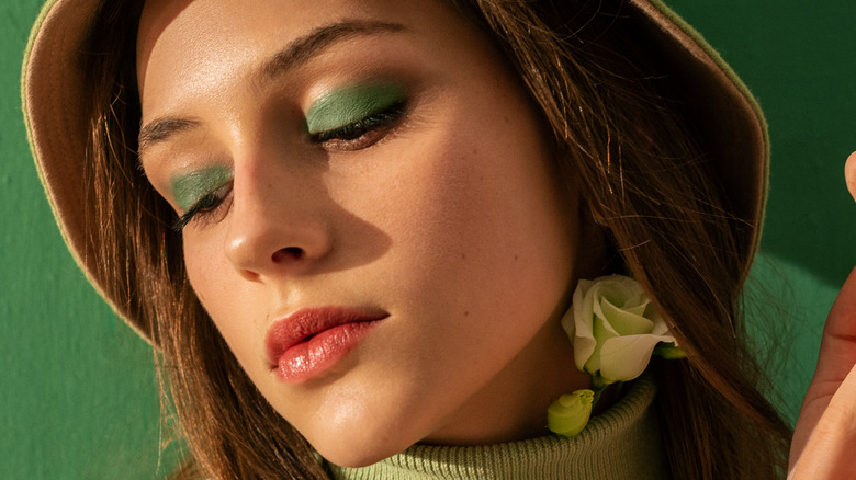 Woman wearing green eyeshadow