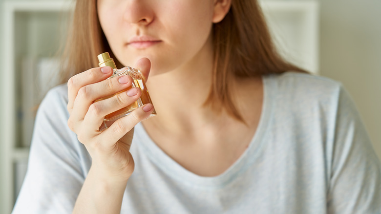 woman smelling perfume