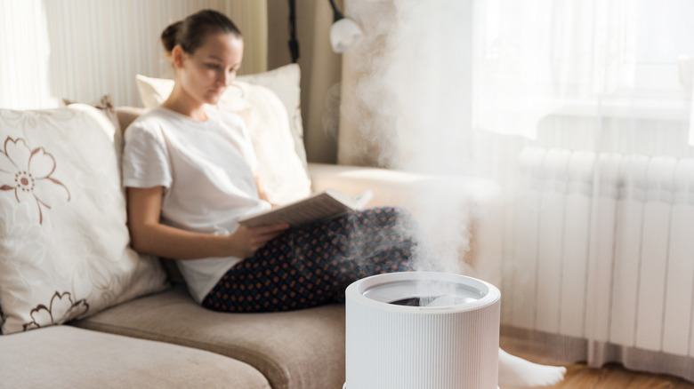 A woman using a humidifier