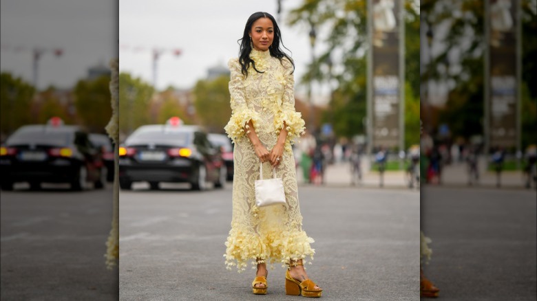 woman in yellow lace floral dress