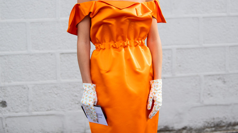 orange dress with floral gloves