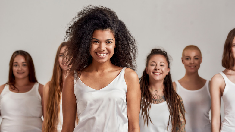 Diverse group of women standing smiling