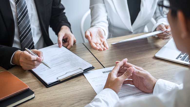 Hands folded in job interview