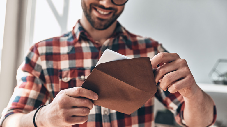 Man reading a card