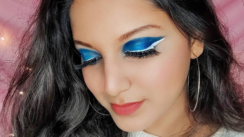 White eyeliner and blue eyeshadow