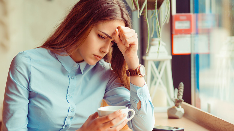 unhappy woman with coffee