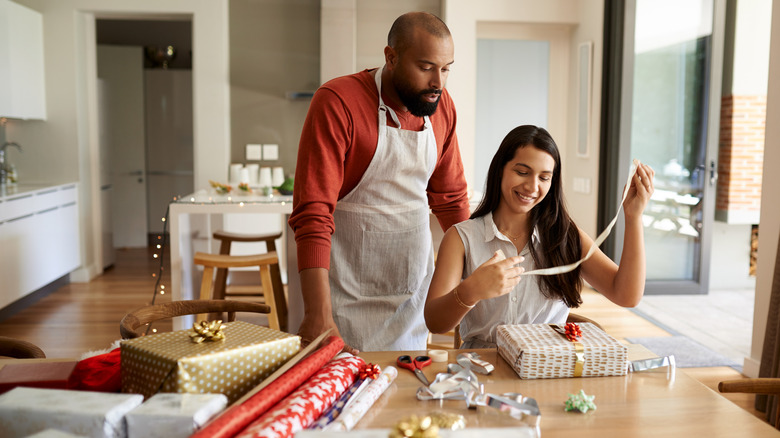 Couple wrapping Christmas presents