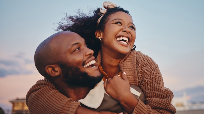 smiling couple embracing