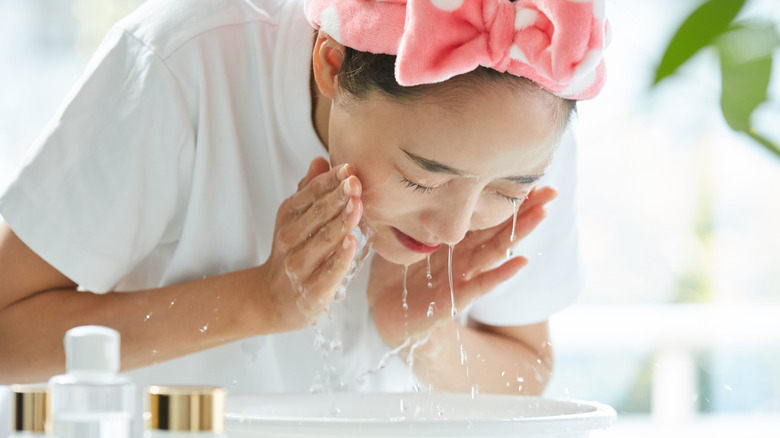 Woman washing face