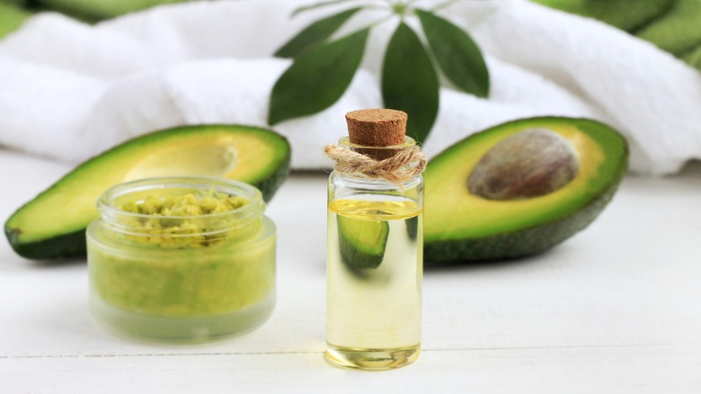 Avocado and avocado oil in jar