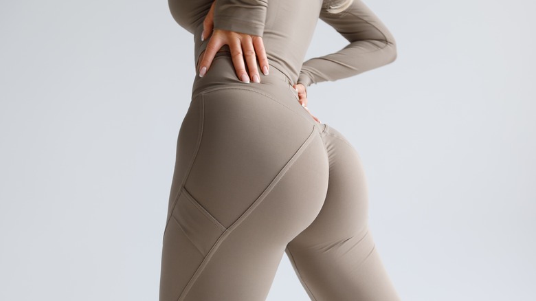 Woman in leggings with toned glutes