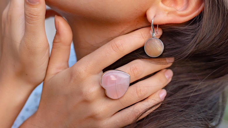 woman wearing rose quartz ring