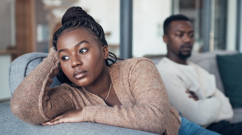 Unhappy couple sitting silently