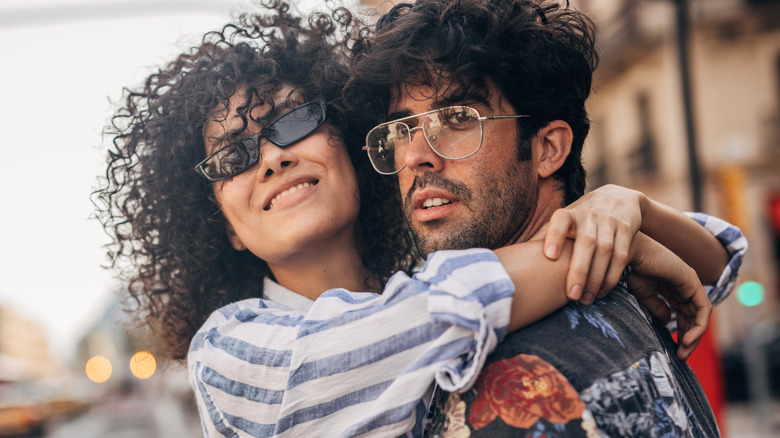 Cool couple hugging outside