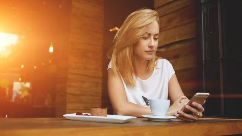 Woman checking mobile phone