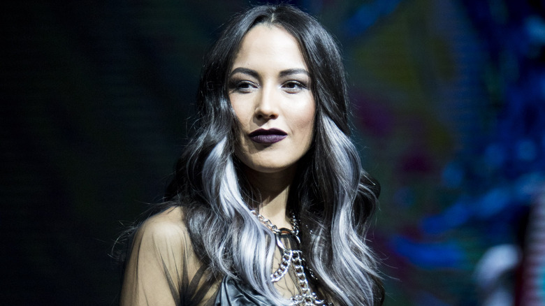 Woman with black hair and silver highlights