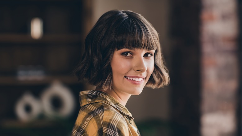 woman with a bob with bangs