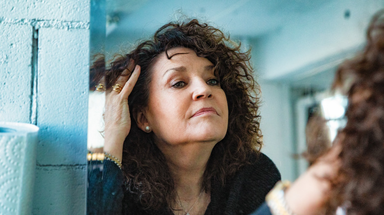 Woman looking at hair