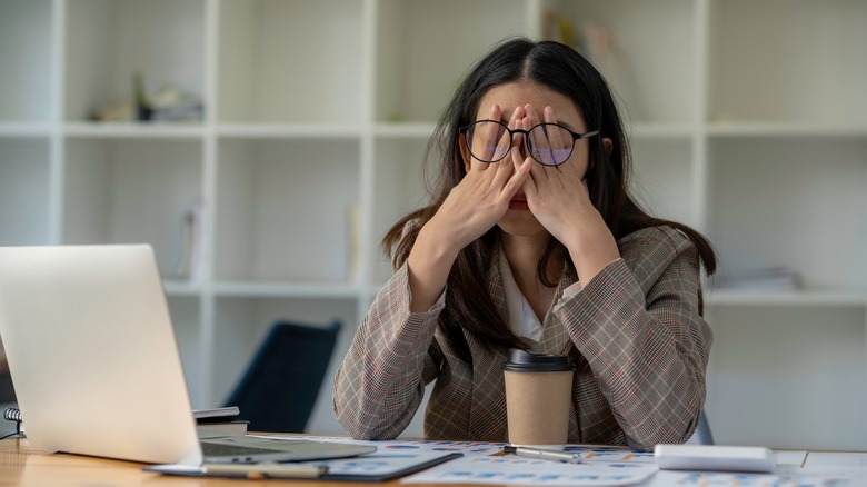 Stressed woman at desk