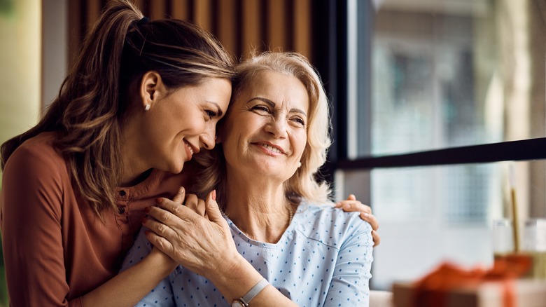 Mother and daughter hugging