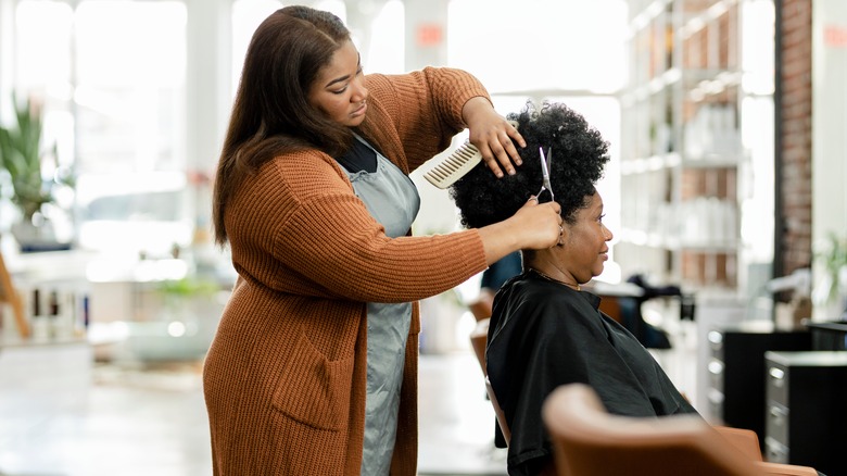 woman getting haircut