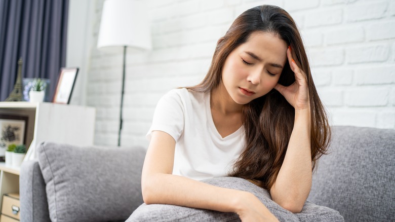 stressed woman on couch