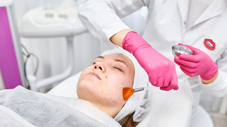 Dermatologist giving chemical peel