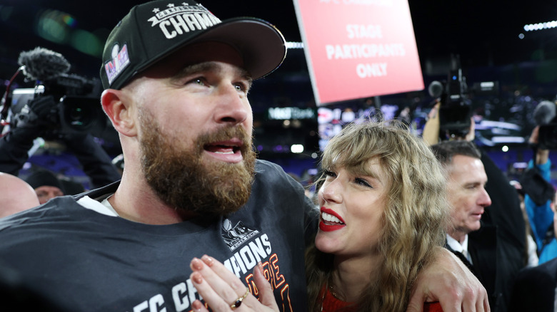 Taylor Swift smiling at Travis Kelce