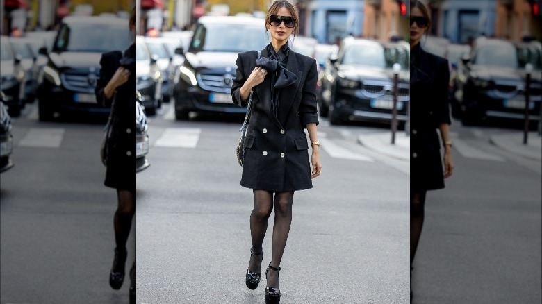 Woman wearing blazer dress with tights
