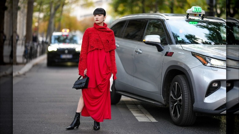 Woman with red maxi dress and sweater