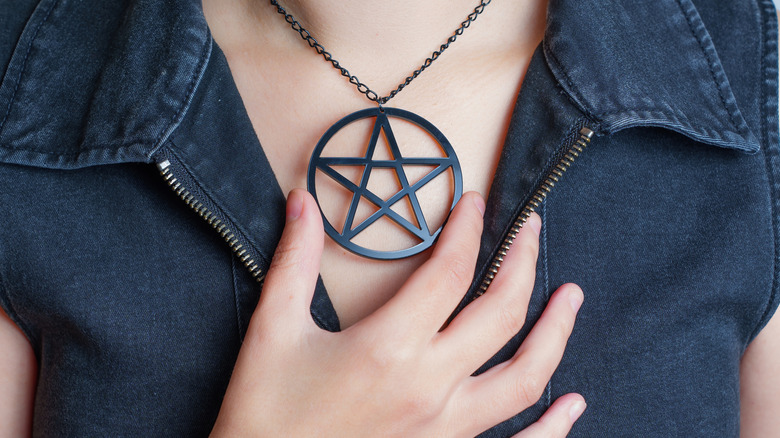 pentacle necklace around neck