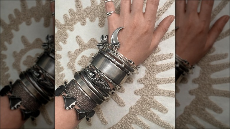 silver bracelets on arm