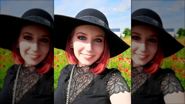 woman in lacey top and wide hat