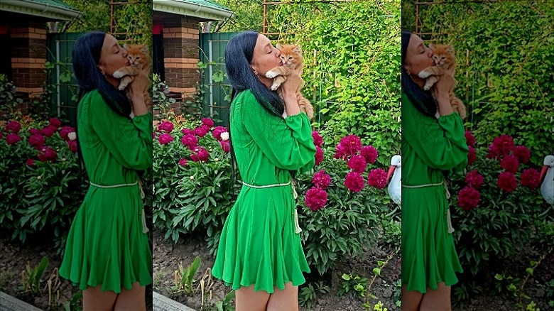 woman standing in garden with witchy brunette hair