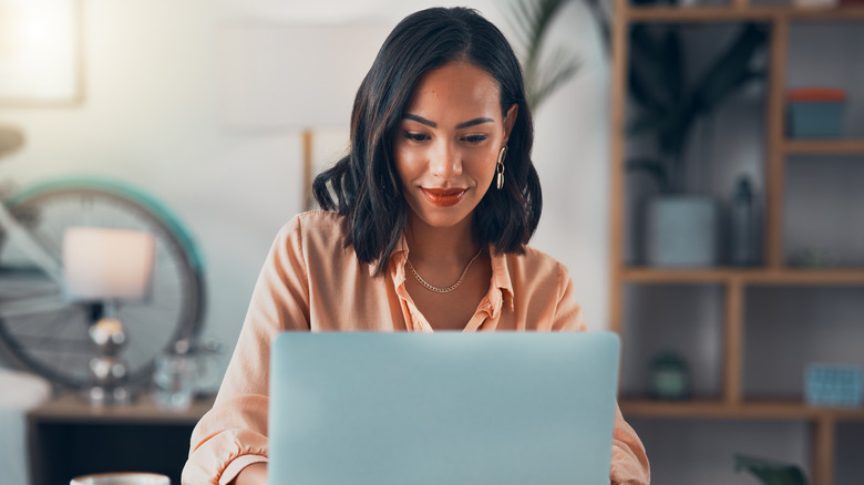 woman focused on laptop