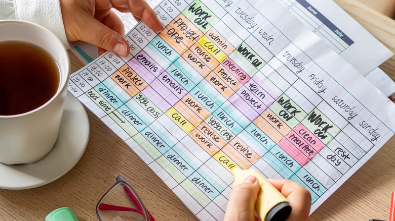 person highlighting schedule