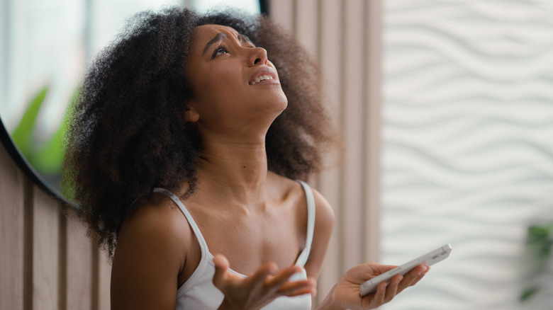 A frustrated woman looking upward.