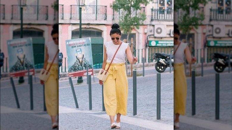 woman in cropped linen pants