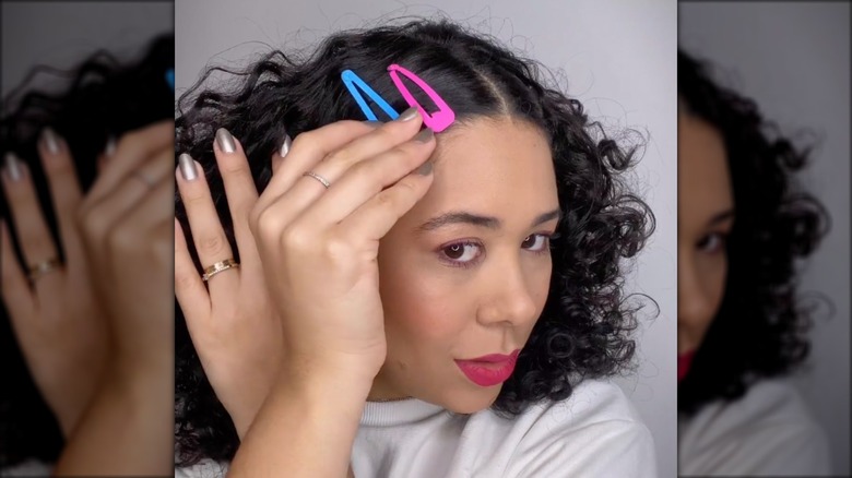 woman wearing pink and blue barrettes