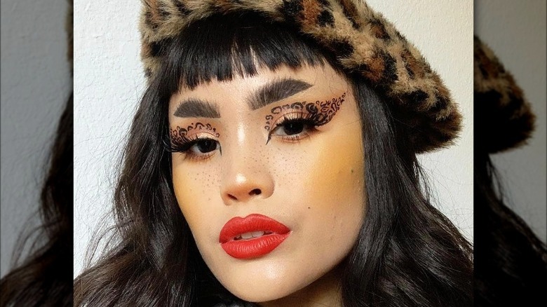 Woman with yellow blush and cheetah eyeshadow